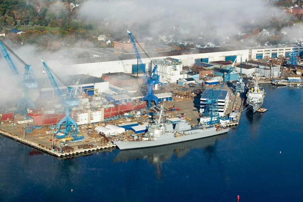 Aerial view of fog over Bath Iron Works and Kennebec River in Maine.